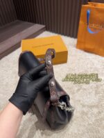 Louis Vuitton Soft Dauphine Epi Black Gold Dauphine Crossbody Bag Black With Gold Hardware Dual Interchangeable Shoulder Straps Structured Silhouette - Image 7