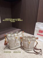 Tory Burch Monogram Distressed Denim Vintage Bucket Bag - Image 10