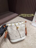 Tory Burch Monogram Distressed Denim Vintage Bucket Bag - Image 11