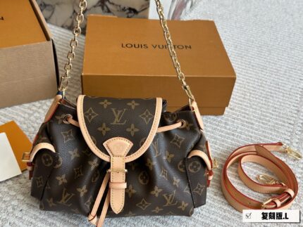 Louis Vuitton Odyssée Metal Chain Side Pockets Multi-Wear Handbag: Carry By Hand, Shoulder Or Crossbody
