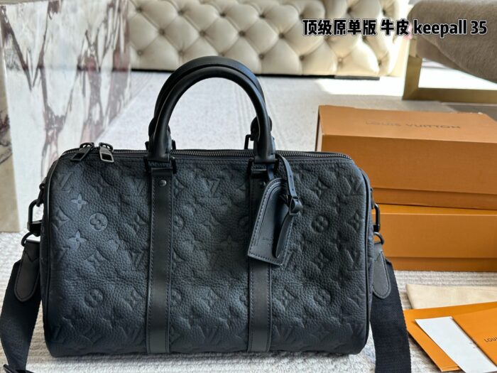 Louis Vuitton Keepall 35 Black Monogram Calfskin Bag With Nylon Wide Shoulder Strap And Luggage Tag - Image 1