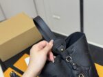 Louis Vuitton Vintage Bucket Bag Distinctive Design Lock-Shaped Decorative Detail - Image 3