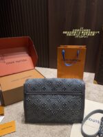 Louis Vuitton Soft Dauphine Denim Crossbody Bag Water-Rippled Pattern With Gold Buckle Black And Gold Colour Scheme Sturdy, Structured Silhouette Dual-Strap Interchangeability - Image 2