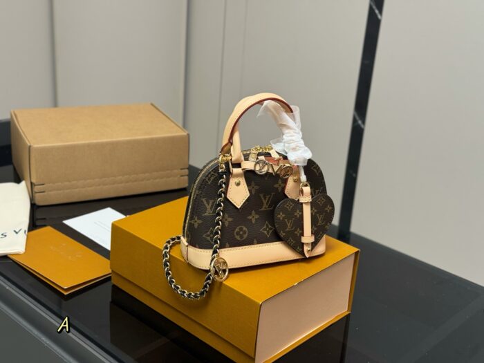 Louis Vuitton Nano Alam Clutch Bag Handheld Or Crossbody Versatile And Elegant Perfect For Summer - Image 1