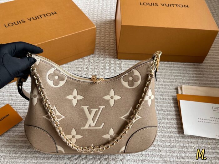 Louis Vuitton Vintage Horn Bag Vintage Classic Shoulder Bag With Shoulder Strap And Chain Versatile For Both Shoulder And Crossbody Carry - Image 1
