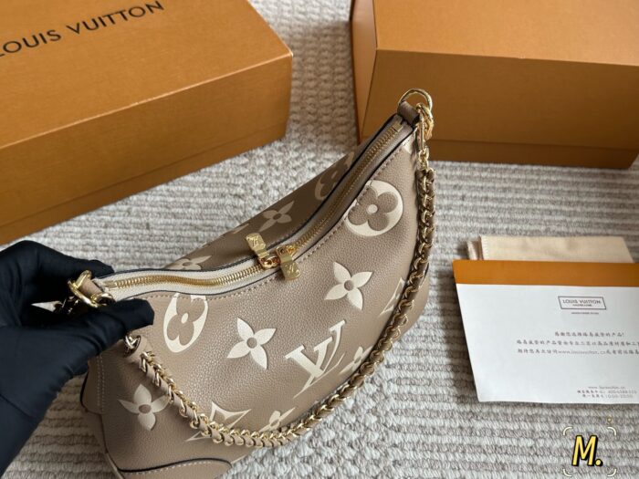 Louis Vuitton Vintage Horn Bag Vintage Classic Shoulder Bag With Shoulder Strap And Chain Versatile For Both Shoulder And Crossbody Carry - Image 2